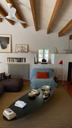 a living room filled with furniture and a flat screen tv