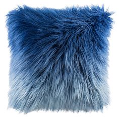 a blue furry pillow on a white background