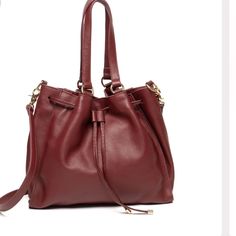 **Brand New!** Brand: Laggo, Color-Wine This Leather Bag Has 2 Big Zippered Pockets. The Bag Is Expandable, Easy To Fit A Laptop. Dimensions: H 14.5’’ W 15’’ D 6’’ 2 Inside Zippered Pockets 1 Wall Zippered Pocket Lining Cotton Pocket Miley- Wine Color, Retails $495 Red Everyday Bucket Bag With Handles, Burgundy Bucket Bag For Daily Use, Everyday Burgundy Bag With Gold-tone Hardware, Wine Color, Wine Colored, New Color, Zipper Pocket, Leather Bag, Bag Lady