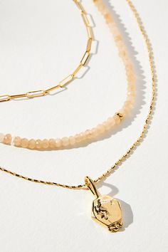 What Makes It Great : There are countless ways to style this set of three versatile necklaces, whether stacking or mixing and matching with existing pieces. | Shades of Sea Triple-Layer Necklace by Anthropologie in Beige, Women's, Gold/Plated Brass Dainty Stackable Necklaces For Layering, Gold Faceted Necklaces For Layering, Everyday Multi-strand Layered Jewelry, Gold Faceted Multi-strand Jewelry, Everyday Multi-strand Layered Charm Necklaces, Gold Layered Beaded Necklaces For Gift, Gold Multi-strand Stackable Jewelry, Triple Layer Necklace, Layer Necklace