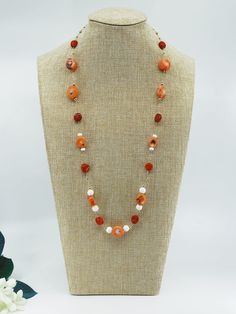 This set is a design sample from The Nine collection which features salmon coral beads in its one-of-a-kind design. ❀ Natural Salmon Coral (10-12mm), Red Coral Coin (10mm), and Seashell Beads (8mm)❀ 14K Gold Filled Clasps and Chain❀ Length: 28 in. Orange Red Coral Beads For Jewelry Making, Elegant Red Coral Gemstone Beads, Elegant Orange Red Coral Beads, Elegant Carnelian Beaded Necklace With Round Beads, Elegant Red Rondelle Beads, Orange Red Coral Necklace With Round Beads, Coral Jewelry With Natural Round Beads, Orange Single Strand Red Coral Jewelry, Elegant Red Coral Beaded Necklace With Faceted Beads