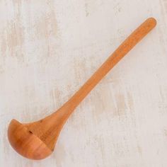 a wooden spoon on a white background