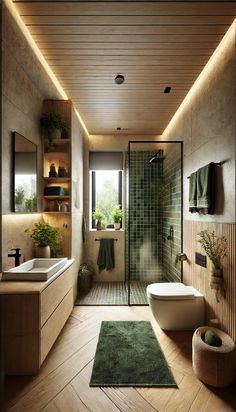 a modern bathroom with wooden floors and green tiles on the walls, along with a large walk - in shower