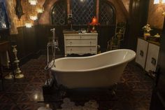 an old fashioned bath tub in a bathroom