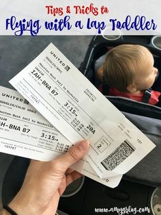 a person holding two tickets in their hand with the words tips and tricks to flying with a top toddler