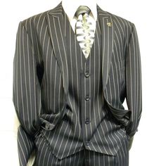 This 2 Button Classic Fit Suit Comes With Bold Pinstripes, A Notch Lapel, And Side Vents. Comes With Matching Vest And Pants. Blue Prom Tuxedo, Matching Vest And Pants, Dark Red Suit, Gangster Suit, Blue Velvet Suit, Red Velvet Suit, Bond Suits, Dark Blue Fashion, Khaki Suits