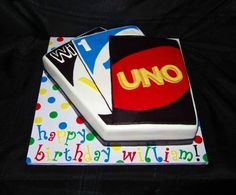 a birthday cake that is shaped like an uno card