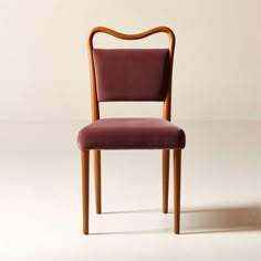 a wooden chair with a purple upholstered seat