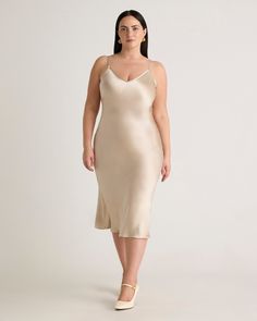 We love the midi length and bias cut of this dress. This super flattering fit is made from 100% mulberry silk, in a satin finish, and is now available in extended sizes. The kicker? Our silk is washable. Easy to style, easy to wash for low-maintenance luxe. Plus, silk fiber contains 18 kinds of amino acids that make it amazing for skin nourishment, hypo-allergenic, and naturally thermoregulating to help maintain body temperature.Also offered in sizes XS-XL. Silk Dresses Outfit, Silk Fiber, Midi Dress Plus Size, Silk Cami, Quarter Zip Sweater, Silk Slip Dress, Body Temperature, Silk Slip, Dress 100