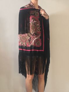 Gorgeous 1970s silk fringe maxi scarf. Perfect boho style worn with whatever you like! Shake your fringe! Add a pop of color pairing it with a black jacket. Wonderful soft silk with a dramatic black and hot pink floral paisley pattern. Hot pink, green, grey, white and black - super ornate and baroque paisley. Black rayon fringe border. Signature on the scarf is illegible. 100% silk. Please dry clean only. Very good vintage condition with no fabric or sewing flaws. Measurements 116cm by 116cm/ 45 Bohemian Shawl With Tassels For Spring, Bohemian Spring Shawl With Tassels, Bohemian Party Scarves For Spring, Bohemian Silk Scarves For Festivals, Bohemian Scarves With Tassels For Spring, Bohemian Fringe Shawl For Spring, Vintage Scarf For Spring Festival, Spring Shawl With Tassels, Black Bohemian Shawl For Fall