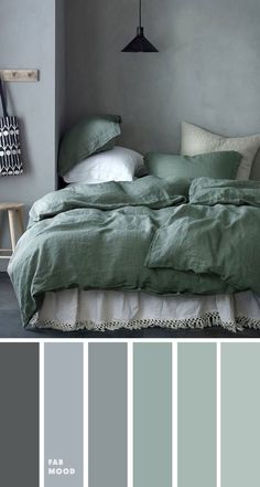 a bedroom with gray walls and green bedding