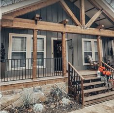 the front porch of a house with stairs leading up to it