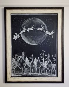 a black and white drawing of santa's sleigh in the night sky