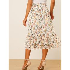 Featuring pretty ditsy floral prints, this midi skirt is a summer option that can be worn with just about anything. Channel elegant style in this midi skirt which is beautifully printed with a blossom pattern for a versatile look. It is made of lightweight fabric, adding definition to the free-flowing design. Falling to a waterfall midi hem, it sits high on the waist with a discreet side zip fastening. Summer days call for effortlessly feminine styles like skirts. Non-stretch Summer Midi Skirt, Vacation Ruffled Midi Skirt, Vacation Midi Ruffled Skirt, Printed Summer Skirt For Day Out, Casual Ditsy Floral Print Skirt, Summer Day Out Printed Skirt, Knee-length Floral Print Skirt For Garden Party, Spring Floral Print Skirted Bottoms, Spring Floral Print Tiered Skirt