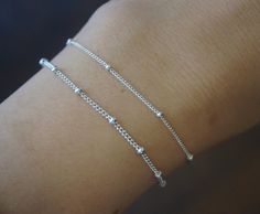 Sterling silver Satellite Bracelet ---Material: Sterling silver ---Bracelet Size: 7 inches, you can also choose to add a 1.5 inches extender, and the size will up to 8.5 inches ---Chain width: 1mm bead size: 2mm ---Really pretty when layered with other bracelets and a terrific addition to any jewelry collection. ---Matching Anklet: https://www.etsy.com/listing/809327614/anklets?ref=shop_home_active_1 Matching Necklace: https://www.etsy.com/listing/941231191/sterling-silver-satellite-18inches?ref Silver Charm Bracelet With Delicate Adjustable Chain, Adjustable Silver Charm Bracelet With Delicate Chain, Silver Adjustable Charm Bracelet With Delicate Chain, Silver Satellite Chain Bracelet, Dainty Nickel-free Silver Chain Bracelet, Adjustable Silver Bracelet With Delicate Chain, Sterling Silver Satellite Chain Bracelet As Gift, Silver Bracelet With Satellite Chain For Gifting, Silver Sterling Bracelets With Satellite Chain