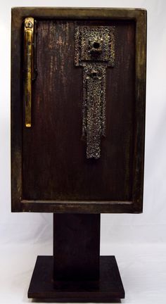 an old wooden box with a cross on the front and door handle is shown against a white background