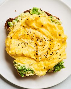 an egg salad sandwich on a white plate