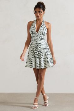 Play with polka this summer in Verde, our charming mini dress. Designed in a fully ruched silhouette of our premium woven fabric, this printed mini features a self-tie halter neckline, bodycon silhouette and ruffled hemline. For a sultry out-of-office look, style yours with some stilettos like Sweet Step.Features - Premium woven fabric- Bodycon fit- Fully ruched- V neckline - Self-tie halter- Invisible zip closure - Ruffled hemline - Mini length Sizing & Fit Model is 5'6.5" and wears UK size 8 / US size 4 Product Information Designed exclusively by Club L London Lined with no stretch Premium woven fabric in White Polka Dot (100% Polyester) 85cm total length SKU: CL134730135 Black Tie Gala, Ruched Mini Dress, Party Dress Long Sleeve, Bridesmaid Outfit, Black Sequin Dress, Black Velvet Dress, Invisible Zip, Party Dress Long, Red Mini Dress