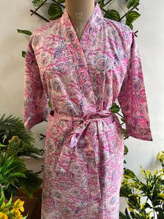 Cotton kimono robes are perfect for lounging around the home or spa. Use our floral printrobe as a cover up on the beach or after a dip in the pool. Add a luxe, boho feel to your bridal shower. Versatile, soft and luxurious, our 100% cotton kimono robes are printed with azo-free dyes. The print floral robe features 3/4th sleeves, a waist tie and two front pocket. Size - One size will fit all sizes S to XL Length - 50 inches (125Centimeter), Measurements Approx : *Length: 50" Inches *Bust Around Size: 48" Inches *Shoulder: 8" Inches *Sleeve Length: 14" Inches *Sleeve hole: 9" Inches *2 Side Pockets For best results hand wash and line dry when possible. Machine wash cold, tumble dry low and warm iron. Floral Print Sleepwear With Kimono Sleeves, Floral Print Kimono Sleeves Sleep Robe, Floral Print Long Sleeve Sleep Kimono, Pink Floral Print Kimono For Loungewear, Long Kimono For Home, Summer Floral Print Robe, Spring Wedding Sleepwear With Kimono Sleeves, Wrap Kimono For Spring Wedding, Pink Sleepwear With Kimono Sleeves For Spring