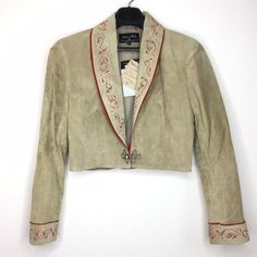 Western Hand Painted Suede Bolero Jacket by artist designer Patricia Wolf. Size: Women's Large. Color: Sand Jacket is in great condition with original tags. Pig Suede. Made in Texas, USA. Please see photos for measurements. Fitted Western Leather Jacket With Long Sleeves, Vintage Fitted Cropped Jacket For Winter, Fitted Vintage Cropped Jacket For Spring, Fitted Vintage Cropped Jacket For Fall, Western Style Fitted Blazer For Fall, Fitted Western Style Outerwear For Spring, Western Style Fitted Leather Jacket For Winter, Fitted Western Style Spring Outerwear, Fitted Western Outerwear For Spring