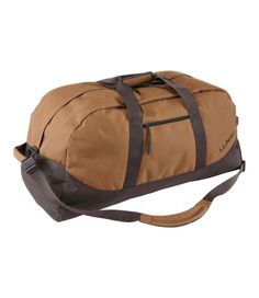 a brown duffel bag sitting on top of a white background