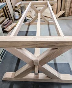 a wooden table being constructed in a shop