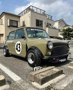 an old car is parked in the parking lot