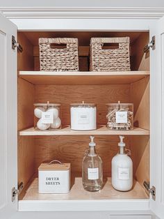 an open cabinet with soap, lotion and other items