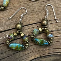 Monday Must Haves Sale These Earrings Have Such Pretty Earthy Colors And A Boho Vibe! They’re Lightweight And Have Great Movement. They’re Made With Antiqued Brass And Aqua, Blue, Green And Brown Beads Then Finished Off With .925 Sterling Silver Ear Wires. They’ve Been Sealed And Polished With Renaissance Jewelry Wax To Keep Them Looking Beautiful For A Long Time! *No Two Pieces Will Ever Be Completely Identical As Each Piece Is Made By Hand. Handmade Items Have Natural Imperfections As They Are Boho Earrings Diy Handmade Jewelry, Czech Beads Jewelry, Rat Girl, Rethunk Junk, Creative Earrings, Boho Jewelry Diy, Czech Glass Jewelry, Beaded Dragonfly, Boho Beads