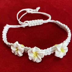 Frangipani Plumeria Flower Bracelet Macrame Bracelet Is Adjustable From 5” Up To 10” With Small Poly Clay Flowers Approx 1/2” In Size Cute White Bracelets With Flower Charm, Hawaiian Flower Bracelet, Plumeria Bracelet, Plumeria Accessories, Tropical 2000s, Hawaiian Flower Necklace, Plumeria Jewelry, Vintage Gold Bracelet, Ombre Bracelet