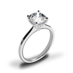 a white gold engagement ring with a round cut diamond