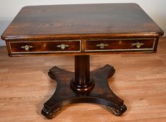 a wooden table with two drawers on it