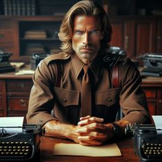 a man in uniform sitting at a desk with an old typewriter