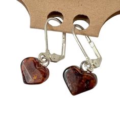 Authentic Baltic Amber Earrings From Lithuania - Length: ~1.2" - Dainty Heart Shaped - Amber Is Naturally Lightweight As It Is Fossilized Tree Resin, Not A Stone - New/Unused Item; Comes With Burlap Jewelry Pouch Lots Of Matching Pieces Listed Separately. Pet And Smoke Free Closet. Fast Shipping! Heart Pendant Amber Jewelry For Gift, Handmade Heart-shaped Amber Jewelry, Baltic Amber Dangle Earrings, Silver And Amber Earrings, Amber Sterling Silver Earrings, Silver Baltic Amber Earrings, Amber Earrings, Golden Brown, Brown Silver