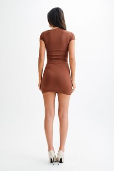 Effortless elegance.The CERSEI Ruched Cap Sleeve Mini Dress is a chic and stylish addition to any wardrobe. It features an asymmetrical neckline and short sleeves, creating a modern and flattering silhouette. The dress is designed with ruching at the waist and neckline, adding texture and elegance. Made from a stretchy fabric, it ensures a comfortable fit while accentuating your figure. The mini length makes it perfect for a night out or any special occasion. Elevate your fashion game with the Cersei Ruched Cap Sleeve Mini Dress. Fitted Cap Sleeve Mini Dress For Summer, Fitted Short Sleeve Dress For Summer Night Out, Summer Stretch Mini Dress With Cap Sleeves, Summer Asymmetrical Ruched Stretch Dress, Fitted Short Sleeve Dress For Spring Night Out, Flattering Stretch Bodycon Dress With Short Sleeves, Flattering Short Sleeve Stretch Bodycon Dress, Chic Fitted Short Sleeve Bodycon Dress, Chic Fitted Bodycon Dress With Short Sleeves