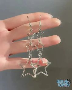 Shine brighter than the stars with these silver dangle earrings! Playful and unique, these earrings are perfect for adding a touch of shine to any outfit. Make a statement while keeping things light and fun. Measures 2 3/4" Sold as one pair of earrings. Sparkle Star Earrings, Silver Star Dangle Earrings, Trendy Silver Star Earrings, Silver Star Charm Earrings, Trendy Silver Star Charm Earrings, Trendy Silver Earrings With Star Charm, Silver Star Charm Earrings For Party, Star Dangle Earrings, Movie Ideas