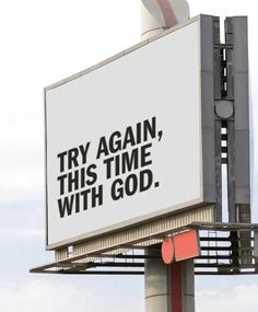 there is a billboard that says try again, this time with god