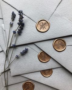 envelopes with wax seals and lavender flowers