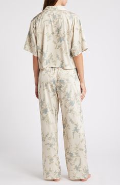 You won't be in any hurry to get dressed in the morning when you're in these relaxed-fit satin PJs featuring a boxy, button-up crop top and matching pants. Top has front-button closure; notched collar; elbow-length sleeves; chest patch pocket Bottoms have elastic waist; side-seam pockets 97% polyester, 3% spandex Machine wash, tumble dry Imported Casual Satin Sleepwear, Spring Cream Relaxed Fit Sleepwear, Relaxed Fit Cream Sleepwear For Spring, Cream Relaxed Fit Sleepwear For Spring, Satin Pjs, Satin Pajamas, Matching Pants, Notched Collar, Elbow Length Sleeve