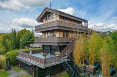 an aerial view of a house with stairs leading up to the upper floor and second story