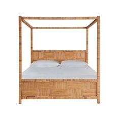 a bamboo bed frame with white sheets and pillows on the bottom, in front of a white background