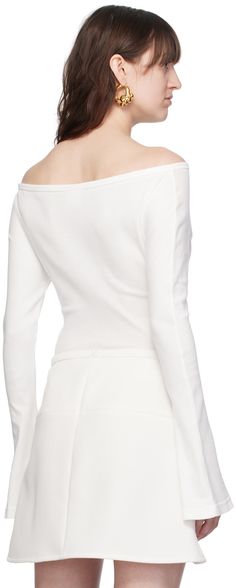 Cotton jersey bodysuit. Rib knit trim throughout. · Off-the-shoulder construction · Boatneck · Logo embroidered at chest · Cutout at front · Press-stud fastening at bottom · Flared cuffs Supplier color: Heritage white Elegant Fitted Off-shoulder Bodysuit, Elegant Off-shoulder Fitted Bodysuit, Classic Fitted Tops With Structured Shoulders, Fitted Long Sleeve Top With Structured Shoulders, Fitted Top With Structured Shoulders And Long Sleeves, Fitted White Tops With Structured Shoulders, Press Studs, White Shop, Boat Neck