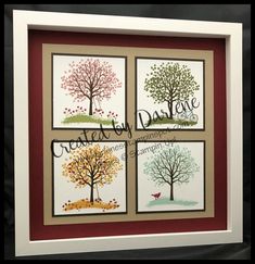 four framed cards with different trees on them