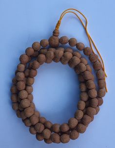 Material: Old Pure Natural Bodhiseeds(also written as bodhi seeds, called Buddhachitta in Tibet and Nepal)  Colour: Mud colour Age: unknown Main Bead: 15-16mm Circumference of the mala: 155cm Main Beads:  Three eye Bodhiseeds   Guru bead: Three eye Bodhiseed ..Quality guaranteed.. -- Origin: Nepal Buddha Chitta: Buddha Chitta(bodhiseed) beads are widely used in pray and meditation and smaller beads are very valuable. We have more sizes on bodhi seeds,please visit our shop. Brown Mala For Healing And Festivals, Spiritual Brown Mala For Festivals, Brown Spiritual Mala For Festivals, Traditional Brown Mala For Meditation, Traditional Brown Mala For Rituals, Traditional Mala For Meditation, Brown 8mm Beads Mala For Rituals, Brown Mala With 8mm Beads For Puja, Brown Mala With 8mm Beads For Rituals