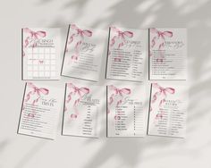 wedding seating chart with pink bows and ribbons on white sheeted paper, top view