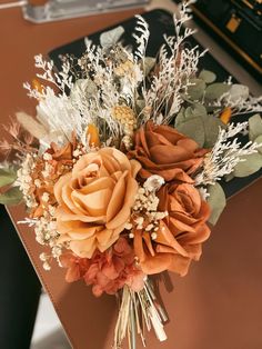 a bouquet of flowers sitting on top of a table