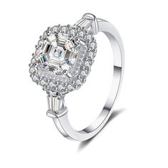 Elevate your love story with our exquisite 10K White Gold Engagement Ring, featuring a stunning princesssquare cut moissanite that radiates brilliance and elegance for the modern woman. Crafted from highquality 10K white gold, this engagement ring showcases a clear, squareshaped moissanite at its center, capturing and reflecting light from every angle. Perfectly designed for women, its timeless princesscut adds a touch of sophistication and sparkle, making it an ideal symbol of enduring affectio Silver Diamond Rings, Stone Properties, Ghost Mannequin, Asscher Diamond, Cushion Cut Moissanite, Jewelry Ads, Picture Style, Moissanite Jewelry, Zircon Ring