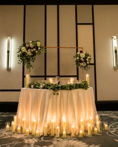 a table with candles and flowers on it