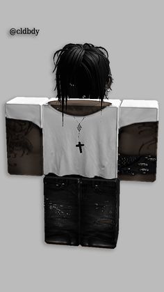 an image of a woman with black hair and cross on her shirt, standing in front of a gray background