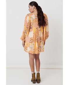 The gorgeous Freda Boho Mini Dress is a new take on our classic Boho shape. This beguiling mini oozes of 1970’s influences from the signature patchwork print of blooming flowers spread across its incredibly voluminous silhouette to its stunning earthy, amber tones. This Boho Mini is versatile with a button through neckline that allows for both a relaxed or more demure look that’s perfect to take you from brunch to bar. With incredible billowing sleeves that have been inserted low into the yolk, Retro Floral Mini Dress For Fall, 70s Inspired Floral Print Dresses, Hippie Mini Dress With Floral Print, Hippie Floral Print Dress For Fall, Hippie Floral Print Fall Dresses, Retro Floral Print Dress For Fall, 70s Inspired Multicolor Fall Dress, Multicolor 70s Inspired Fall Dresses, Hippie Brown Floral Print Dress